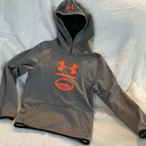 Kids Under Armour pullover grey hoodie with orange logo.